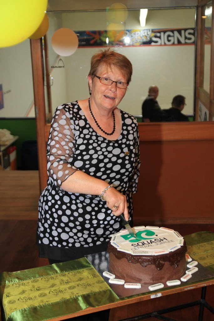 Joss Urbahn (life member cuts 50th Jubilee cake